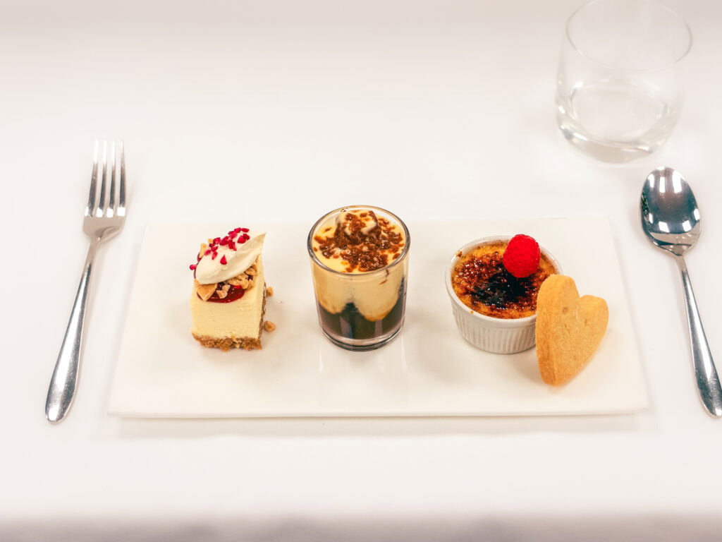 Delicious selection of desserts served on a white plate at Vanilla In Allseasons, Cheshire's premier outdoor dining spot.